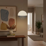 Pendant lit from within, throwing a soft even glow onto the surface below