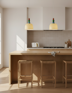 Two beaded pendants above a pale timber kitchen island with bar stools