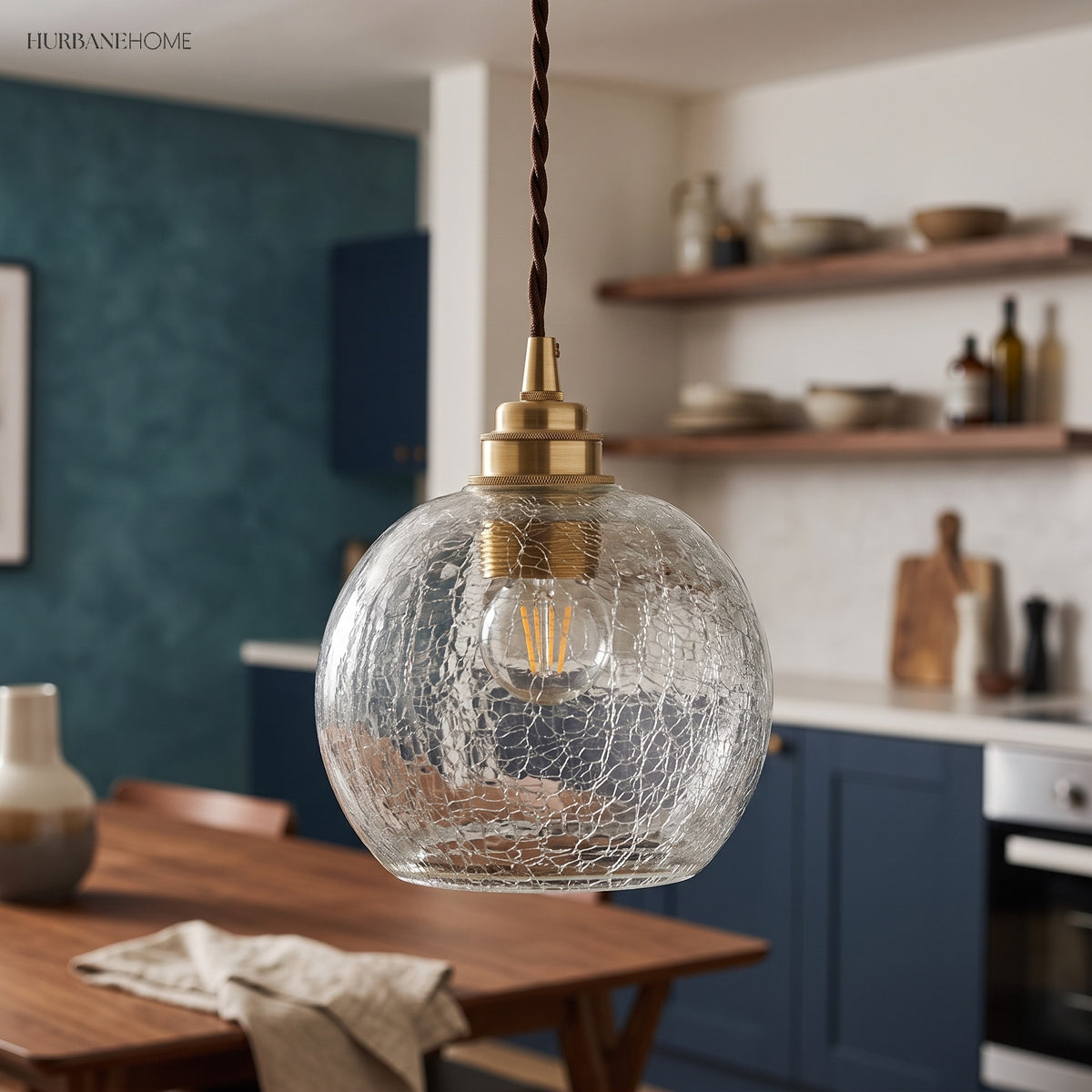 Crackle sphere pendant in a teal kitchen with open timber shelves