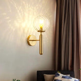 Gold ripple glass sconce lit beside heavy curtains in a living room