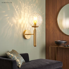Ripple glass sconce casting a starburst light pattern above a sofa