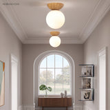 Glass globe semi-flush ceiling light in a styled interior