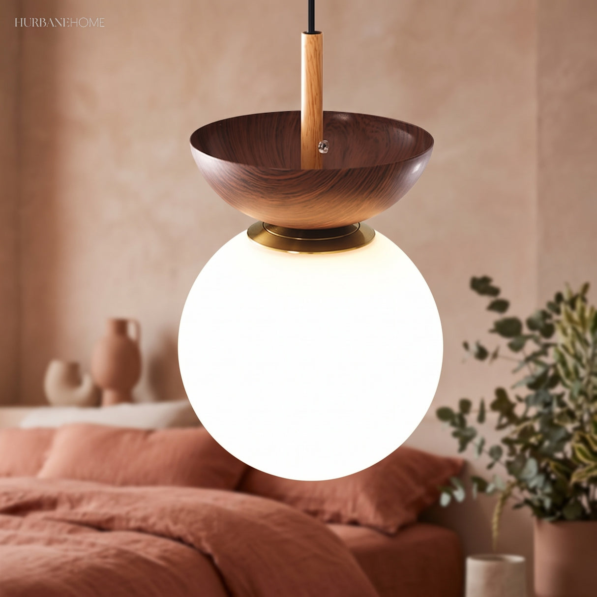 Glass globe ceiling light in a styled bedroom