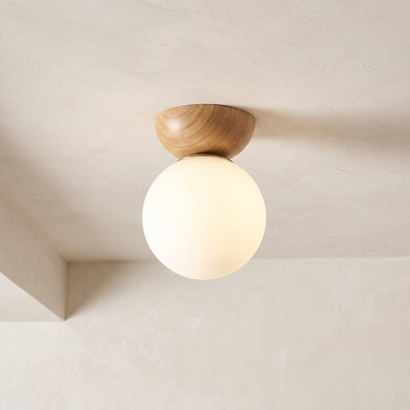 Glass globe semi-flush ceiling light with wooden mount, product photo