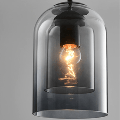 Close view of the filament bulb inside the inner glass cylinder