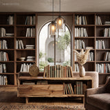Glass pendants lit in a library beside tall bookshelves