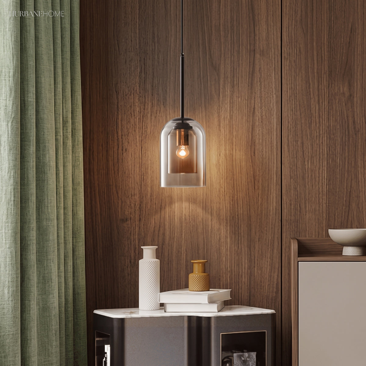 Smoke glass pendant lit against a walnut panelled wall