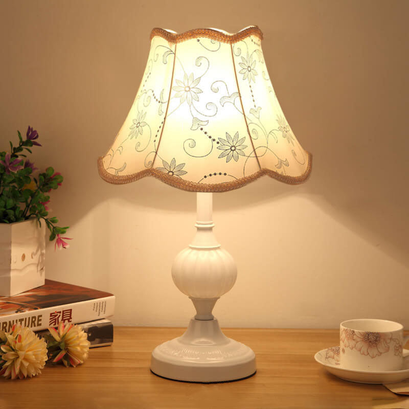 Table lamp with embroidered grey daisy shade and white fluted base