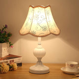 Table lamp with embroidered grey daisy shade and white fluted base