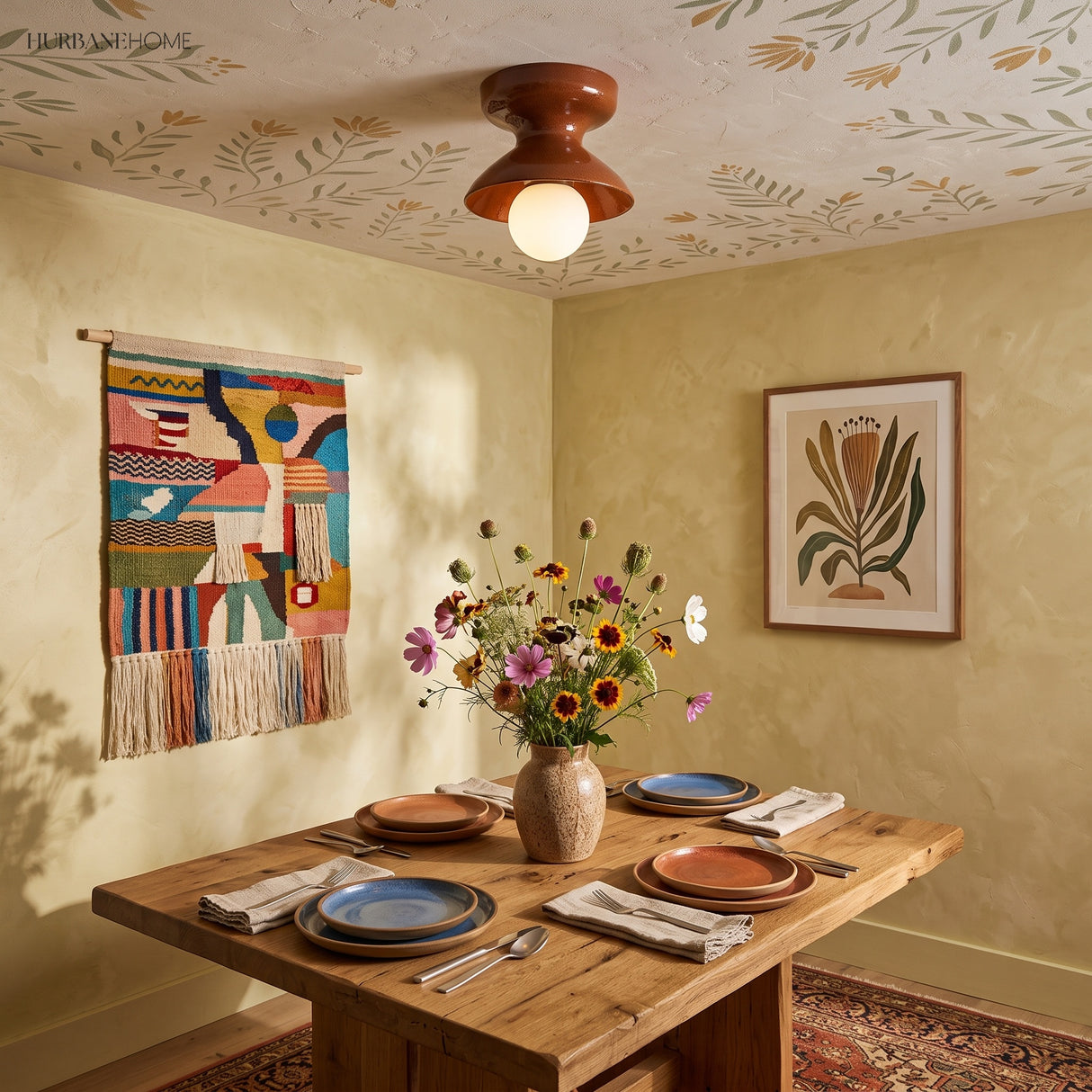 Rust glazed ceramic flush mount on a patterned ceiling above a dining table