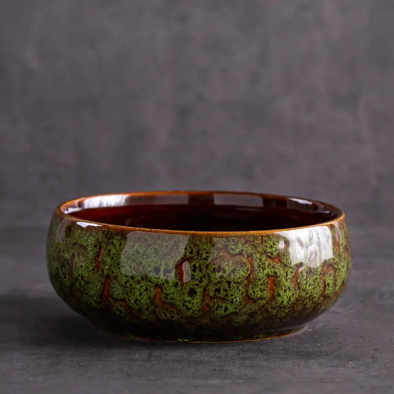 Glazed ceramic pots showcasing lotus plant arrangement