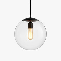 Single clear glass globe pendant with a black cap on white
