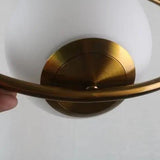 Close view of the brushed brass ceiling canopy and cable fitting