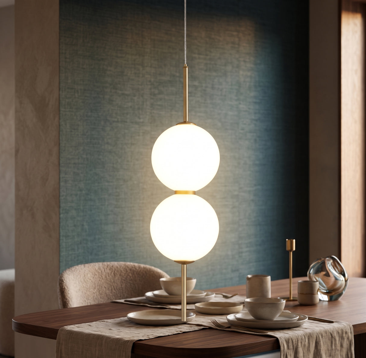 Two opal glass globes on a brass rod above a set dining table