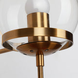 Close view of the brass ring holding the clear glass globe in place