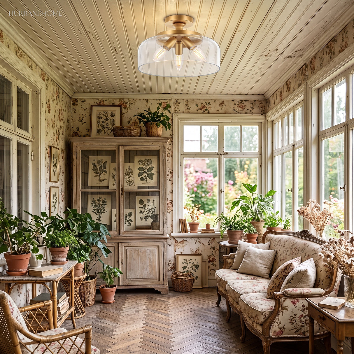 Gold floral glass flush mount light in a sunroom with plants and windows
