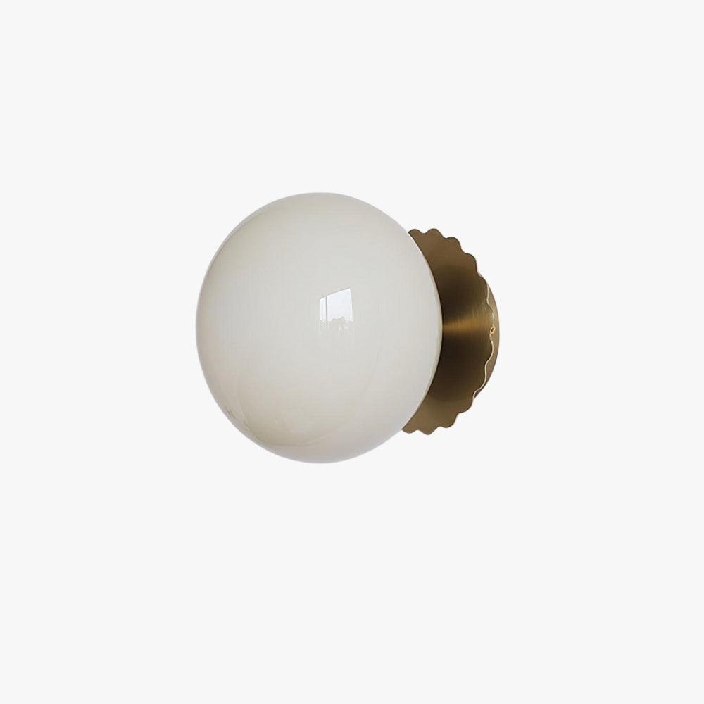 Opal glass globe wall sconce on a gold scalloped backplate, view 1