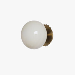 Opal glass globe wall sconce on a gold scalloped backplate, view 1