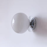 Pink glass globe wall sconce with a gold scalloped plate, view 27