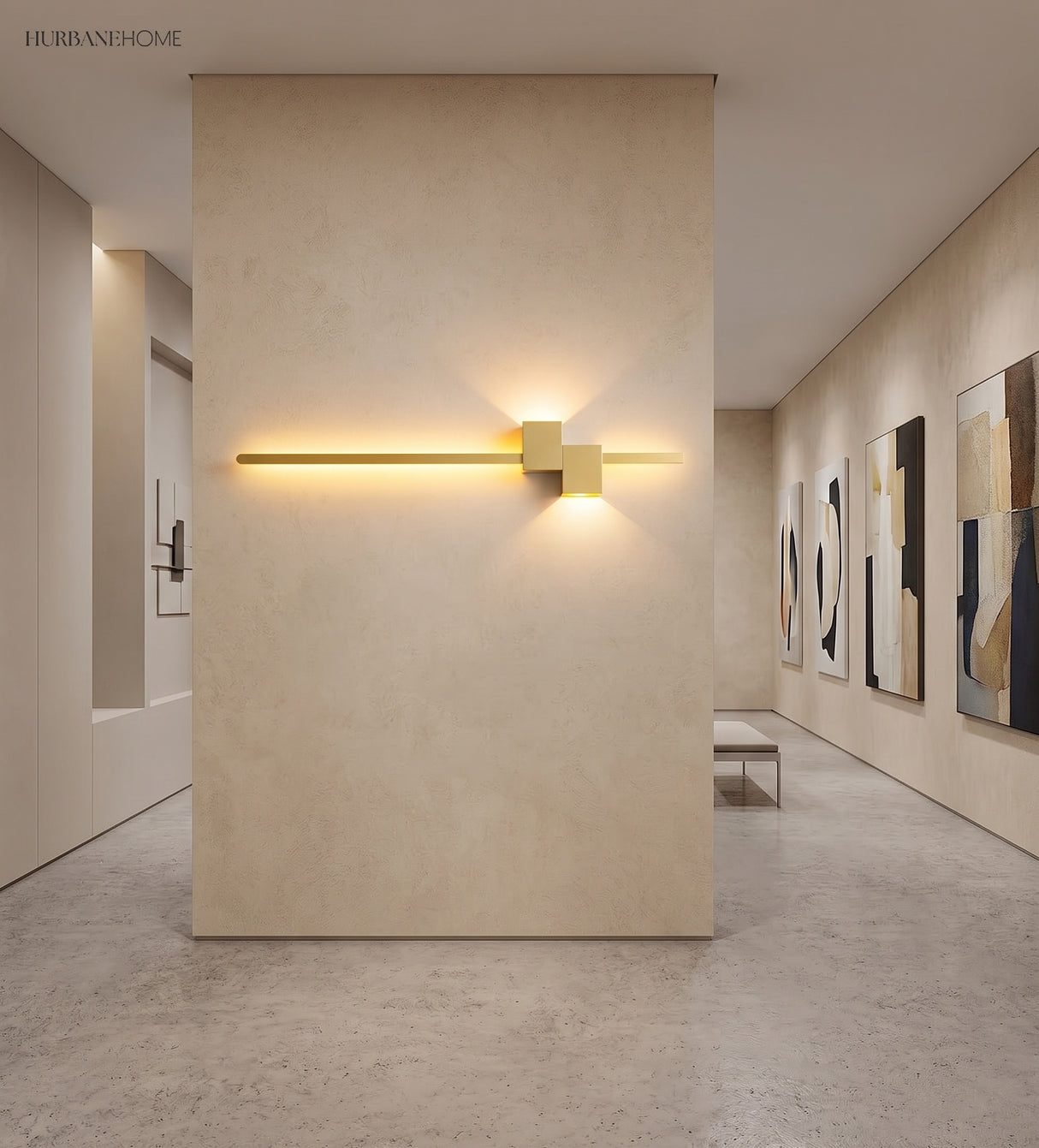 Gold LED wall sconce casting warm light in a gallery corridor