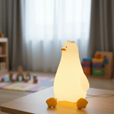 Goose silicone night light glowing warm on a table in a bright playroom
