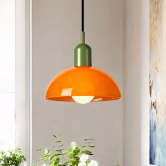 Green glass bowl pendant light with matching metal cap on white