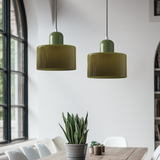 Two green glass pendant lights in a dining room with tall arched windows