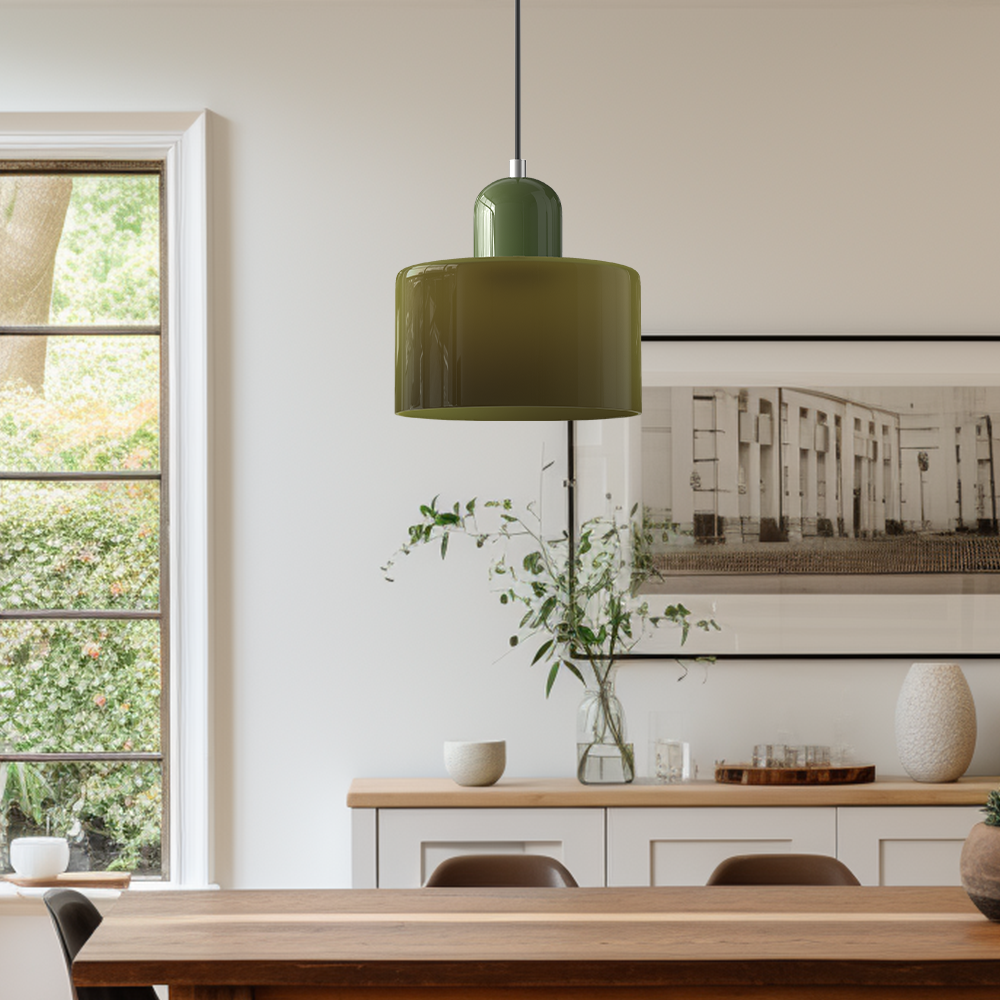 Single green glass pendant light above a wooden dining room sideboard