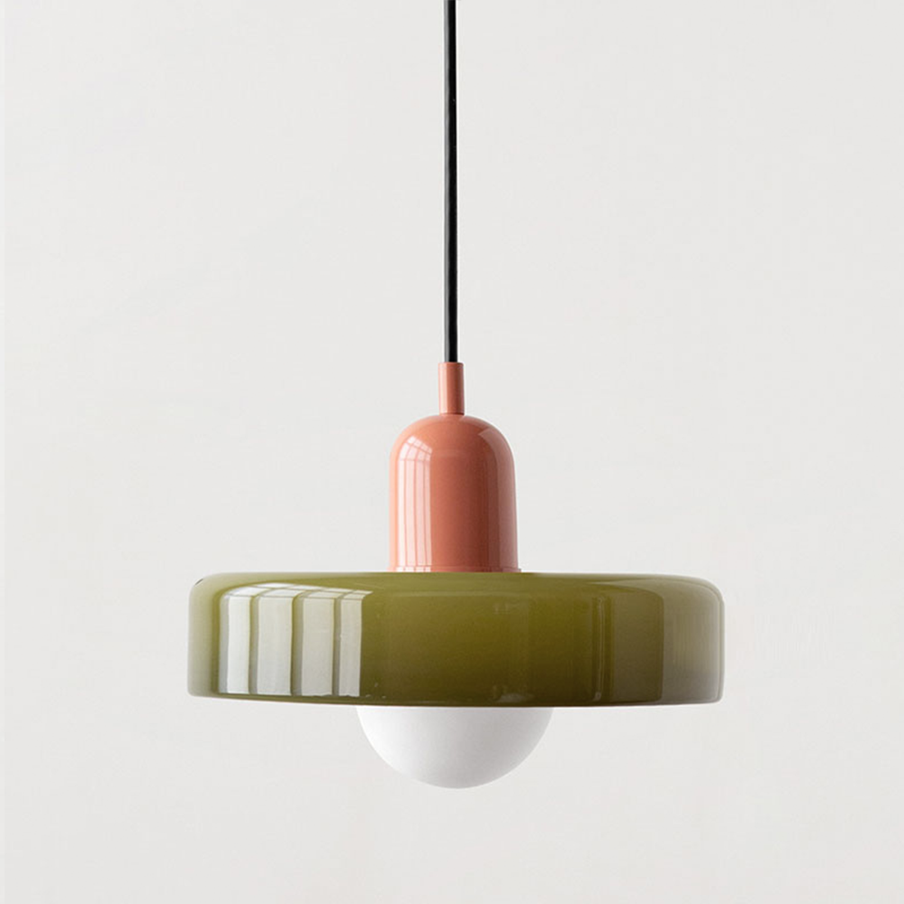 Olive glass disc shade paired with a terracotta pink lamp holder and black cord