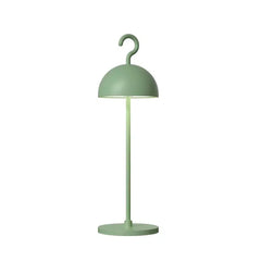 Sage green metal dome table lamp with hook handle shown on a plain background