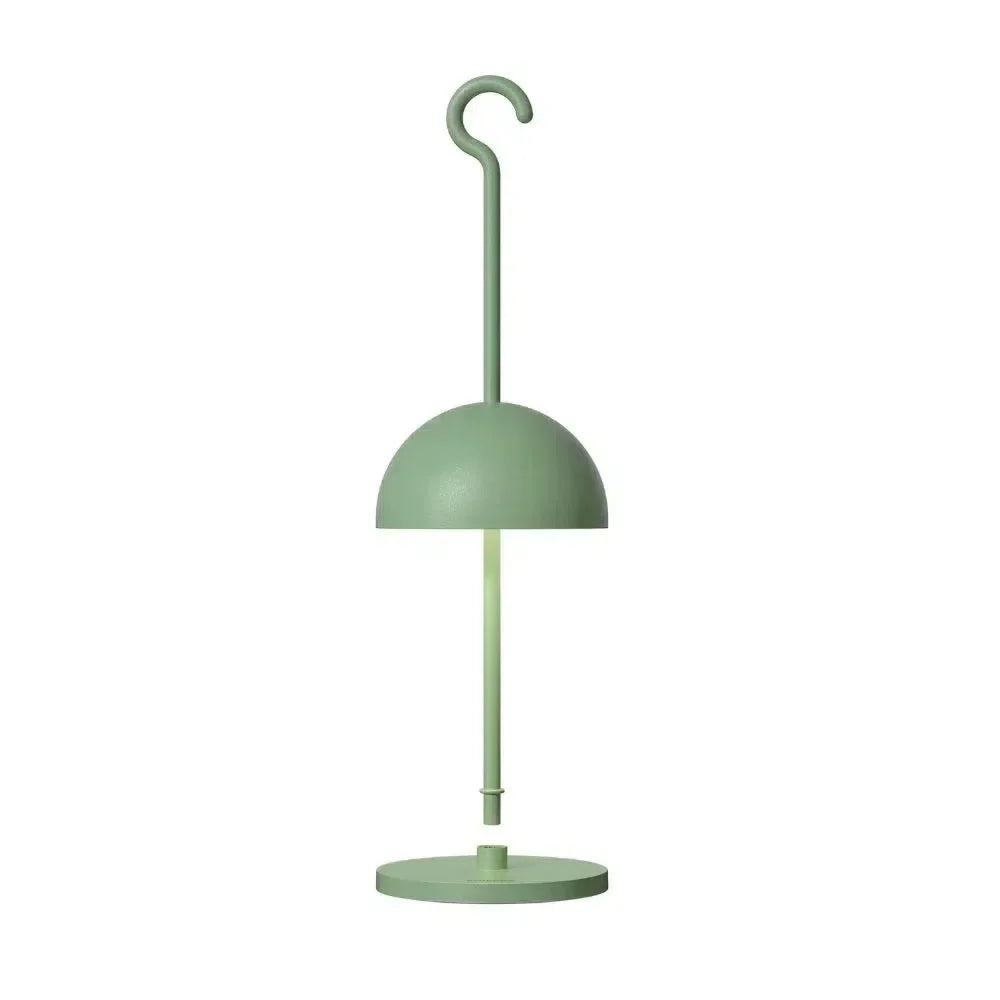 Green rechargeable table lamp with dome shade and hanging hook, side profile view