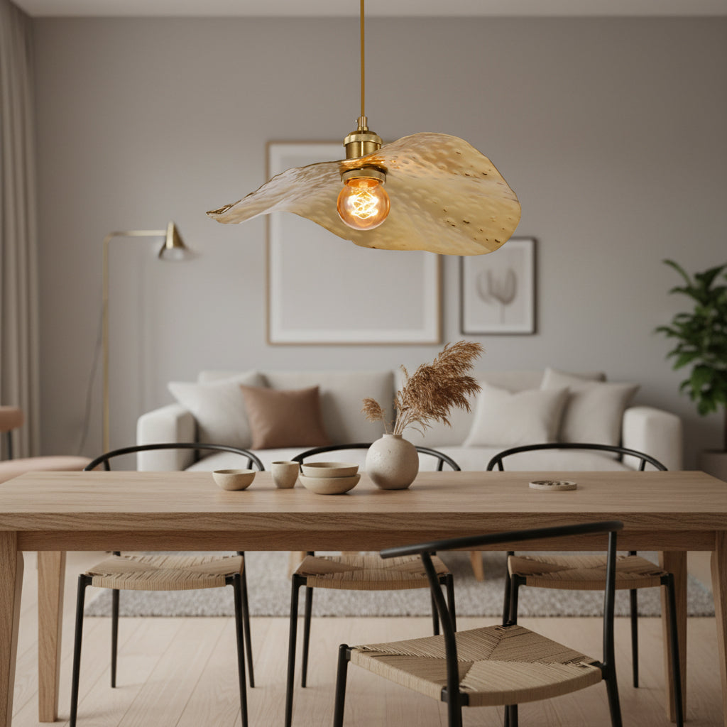 Hammered gold pendant lights suspended in a bright modern living room