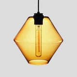 Amber faceted glass pendant with angled sides and a filament bulb