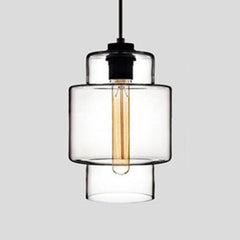 Clear stepped glass pendant with a wide upper band, shown lit