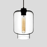 Clear tapered glass pendant with a black cap, lit against grey