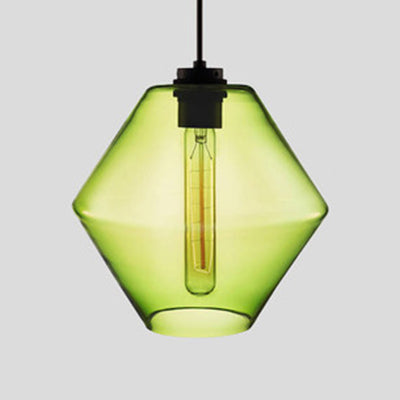 Green faceted glass pendant with angled sides and a filament bulb