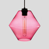 Pink faceted glass pendant with angled sides and a filament bulb
