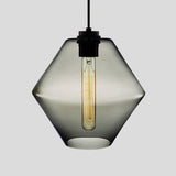 Smoke grey faceted glass pendant with angled sides, shown lit