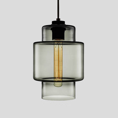 Smoke grey stepped glass pendant with a wide upper band, lit