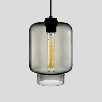 Smoke grey tapered glass pendant with a black cap, shown lit