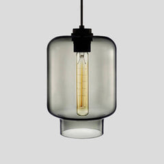 Smoke grey tapered glass pendant with a black cap, shown lit