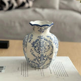 Hand painted porcelain vase with floral blue and white design