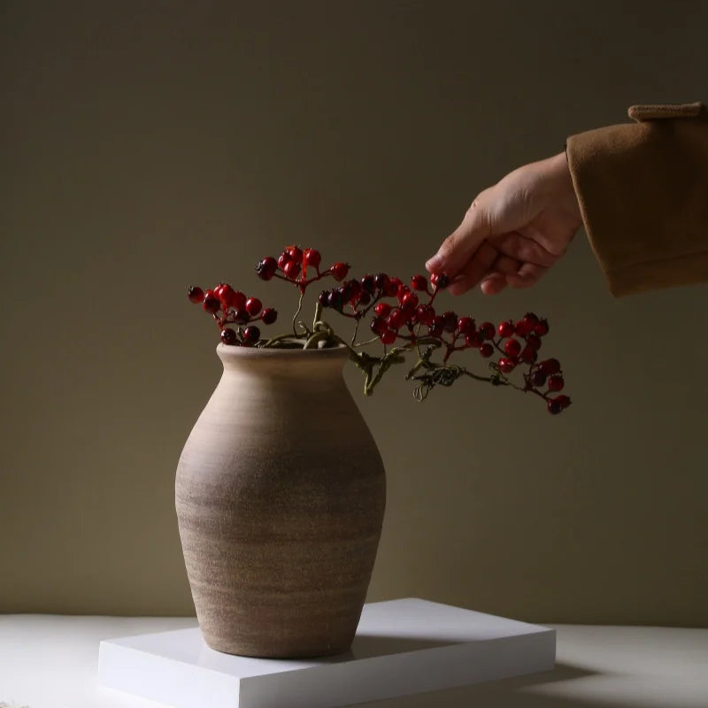 Elegant handmade ceramic vase on wooden table