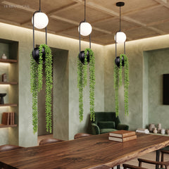 Row of planter pendants with trailing plants above a long table