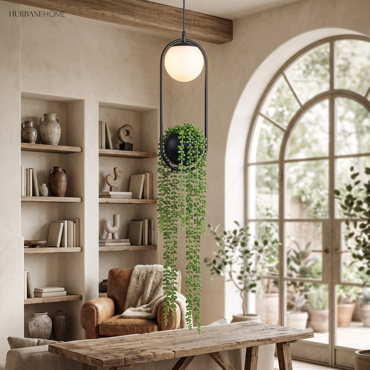Planter pendant lit beside a tall arched window and open shelving