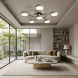 Sage green modern circular LED ceiling light in a serene lounge overlooking a garden courtyard
