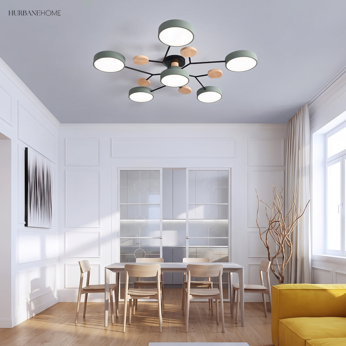 Sage green modern circular LED ceiling light in a bright panelled dining room with timber chairs