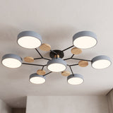 Modern circular LED ceiling light with grey discs and wood accents mounted on a plain ceiling