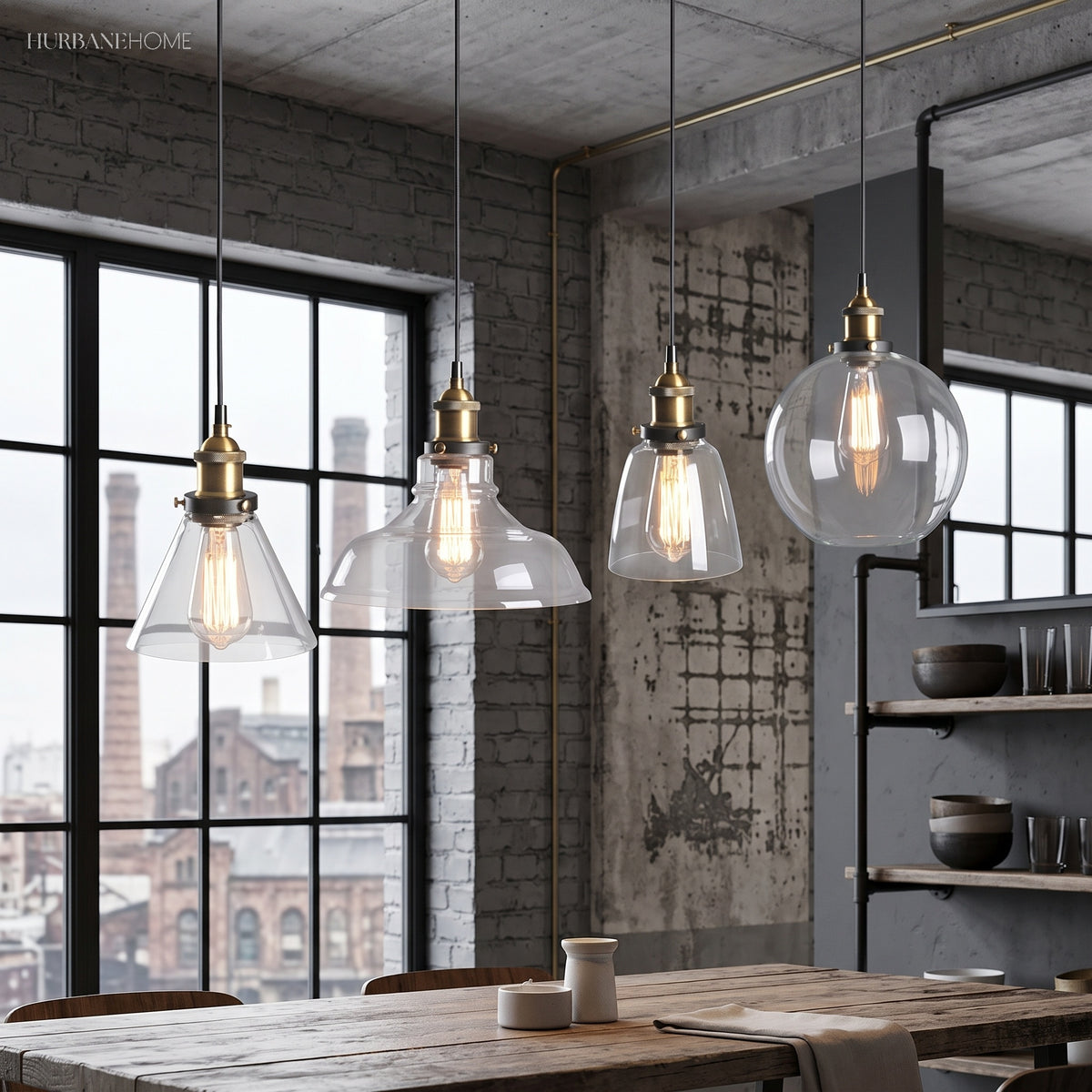 Four glass pendant lights over a long dining table by industrial windows