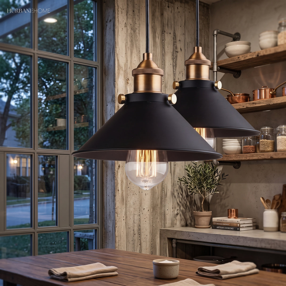 Two black cone pendants lit above a kitchen worktop by a window